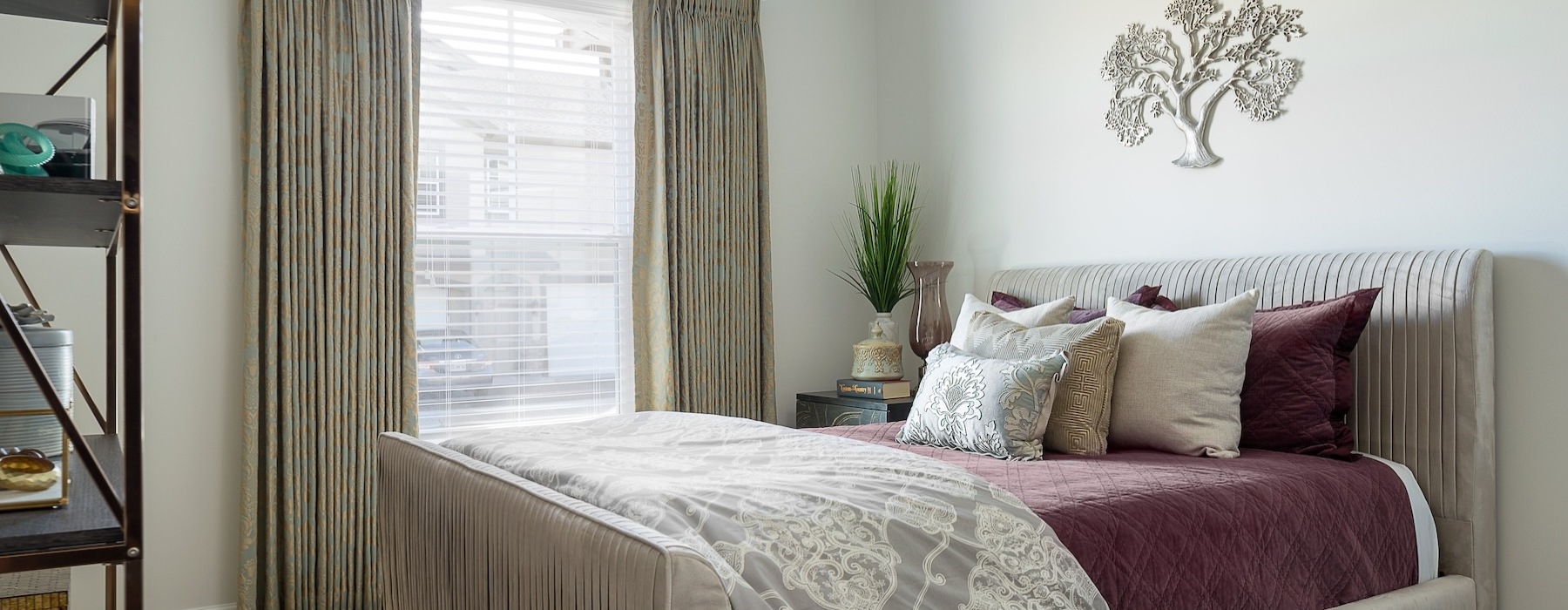 a bedroom with a fan and a bed