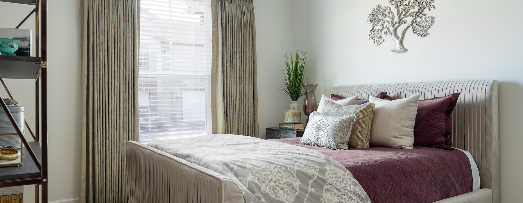 a bedroom with a fan and a bed