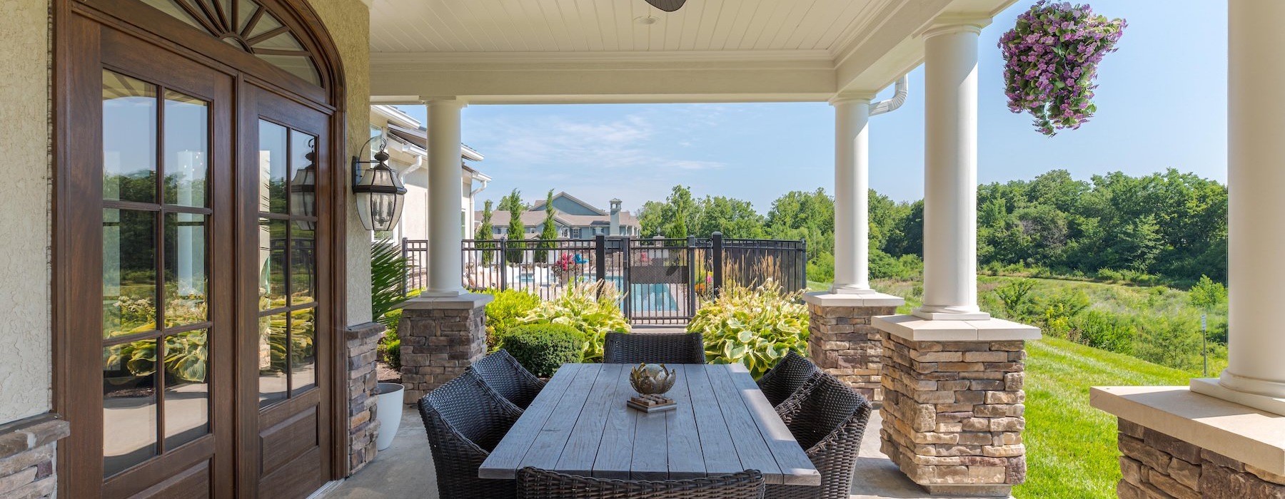 a patio with a table and chairs