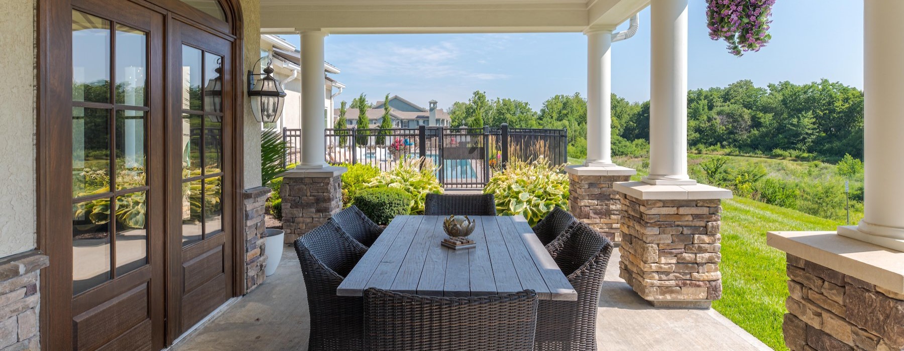 a patio with a table and chairs