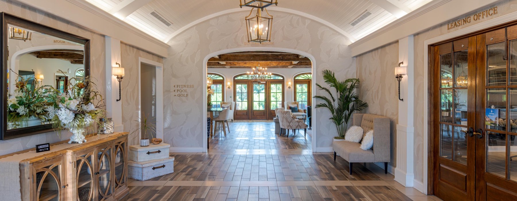 a leasing office hallway with wooden floors