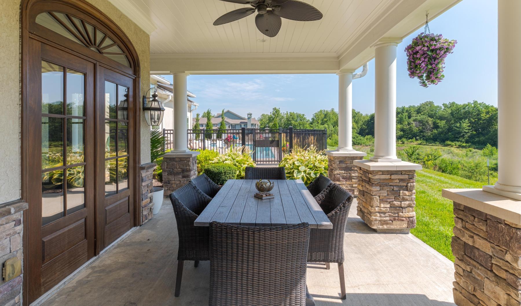 a patio with a table and chairs