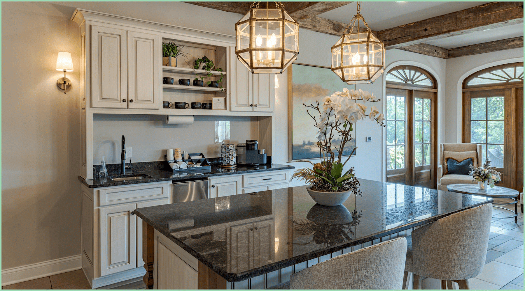 a kitchen with an island and light fixtures
